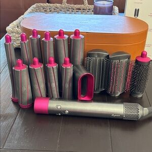 Dyson Airwrap Complete styling set in Gray and Fuchsia with brown storage case